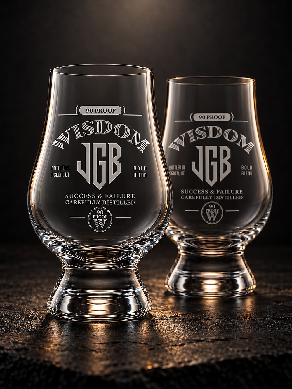 Bourbon Room rocks glasses, set of two. Lead free crystal bourbon glasses etched with the arched 90 Proof Wisdom mark and JGB shield monogram, $95 preorder.