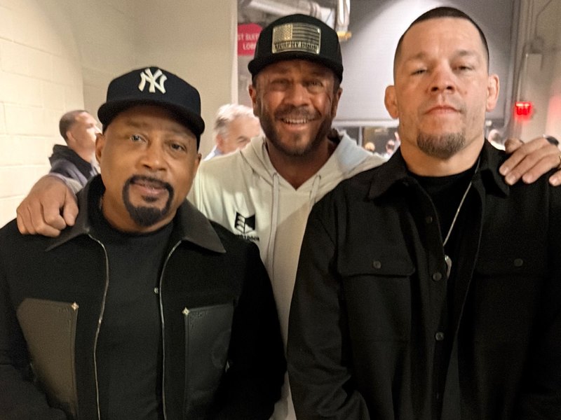 Jeremy Barker with Daymond John and Nate Diaz backstage