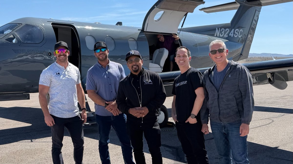 Jeremy Barker with a CEO Access trip crew in front of a Pilatus jet
