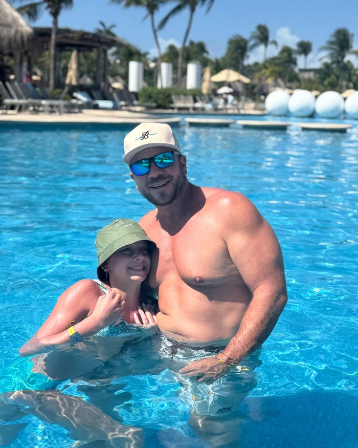 Jeremy with his daughter at the pool