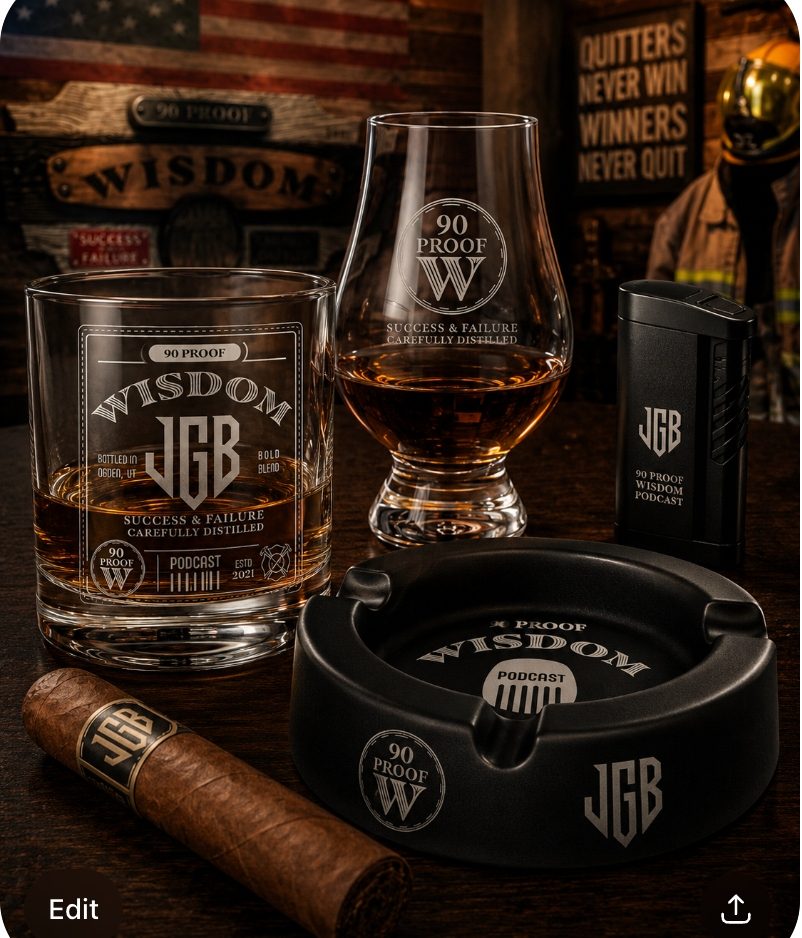 The 90 Proof Wisdom Bourbon Room Set by JGB. etched 90 PROOF WISDOM rocks glass with JGB shield, Glencairn whiskey tasting glass with 90 Proof W mark, matte-black JGB ceramic-coated butane lighter, matte-black 90 Proof Wisdom Podcast ashtray, and JGB-banded long-filler cigar staged on dark walnut against the 90 Proof Wisdom bar wall. American flag, firefighter turnout coat, etched WISDOM and SUCCESS & FAILURE bourbon-barrel signs, and the QUITTERS NEVER WIN, WINNERS NEVER QUIT manifesto plaque.