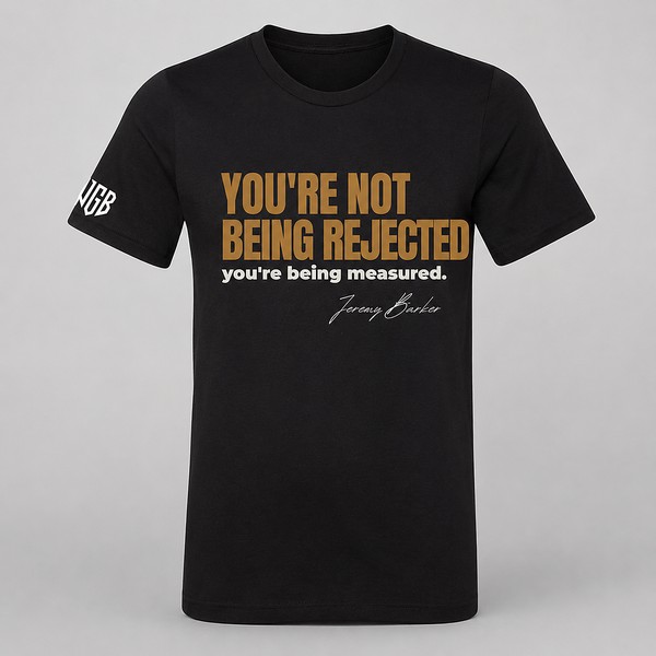 Quoted T by Jeremy Barker reading You’re Not Being Rejected, You’re Being Measured. Entrepreneur streetwear mindset tee on a premium BYLT blank, $50.